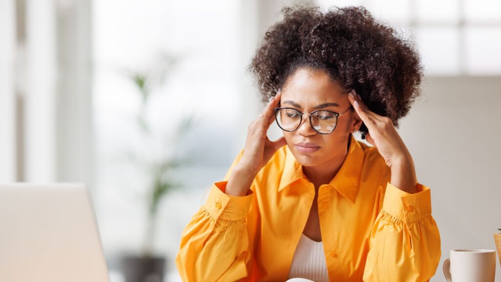 3 Quick Practices to Regain Focus and Reduce Overwhelm Person practicing mindful breathing to regain focus and reduce overwhelm in a serene environment.